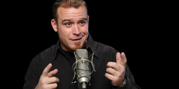 A comedian entertaining an audience and making them laugh.