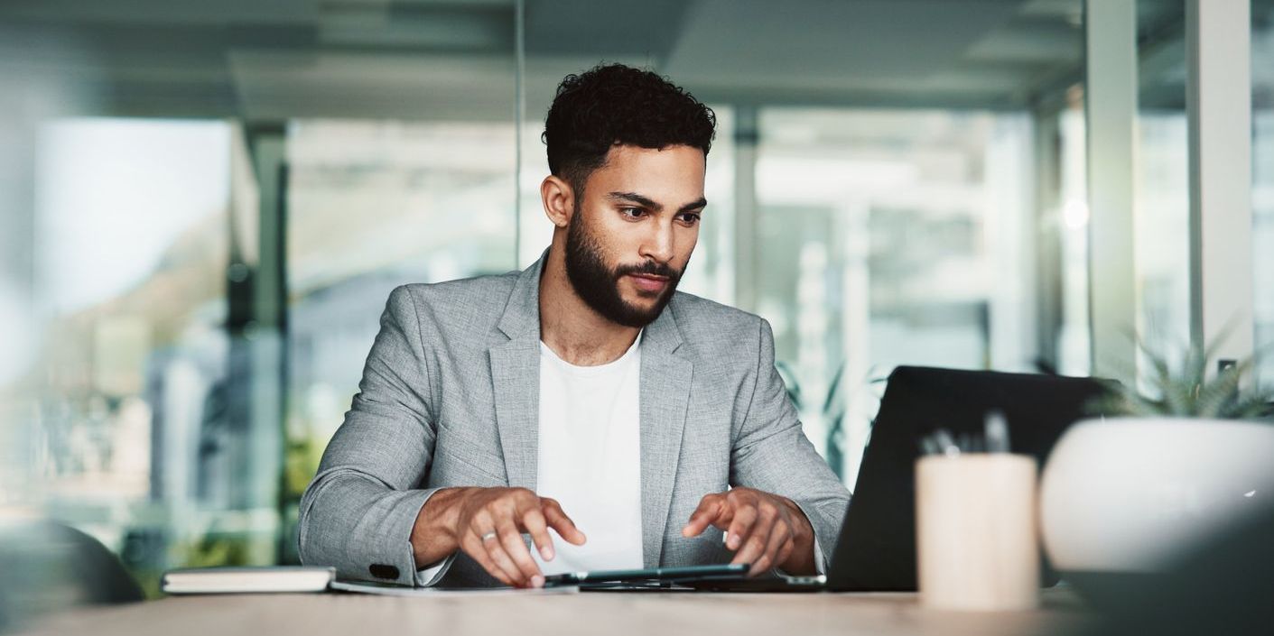 An investigative journalist working on his computer.