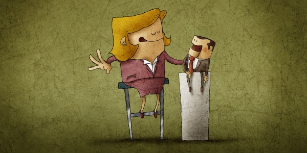 A ventriloquist using two puppets.