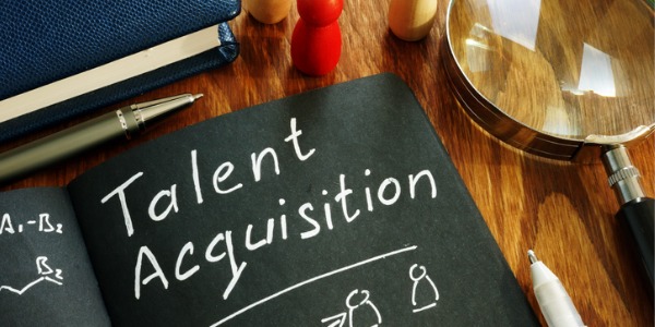 Talent acquisition sign on a desk. Recruitment concept.
