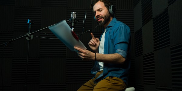A voice actor reading from a script.
