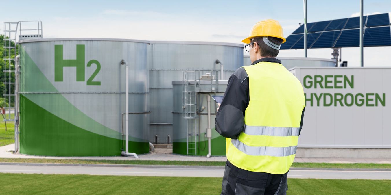 A hydrogen engineer outside a green hydrogen factory.
