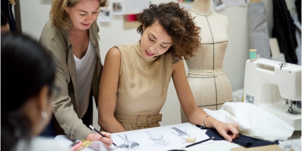 A costume designer sketching out wardrobe designs.