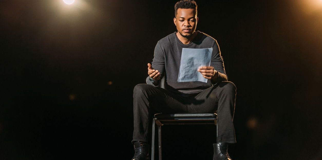 A character actor reading a script.