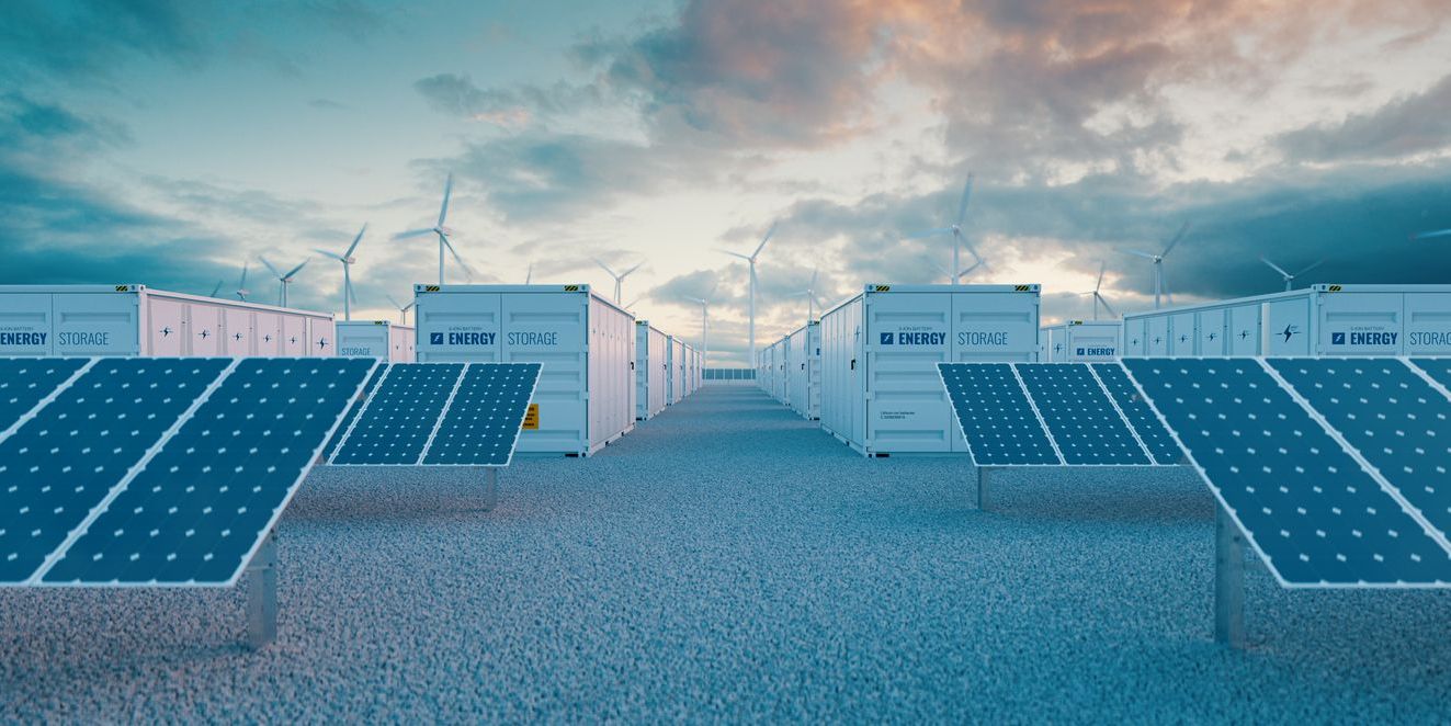 Concept of energy storage systems.Battery storage power station accompanied by solar and wind turbine power plants - 3d rendering.