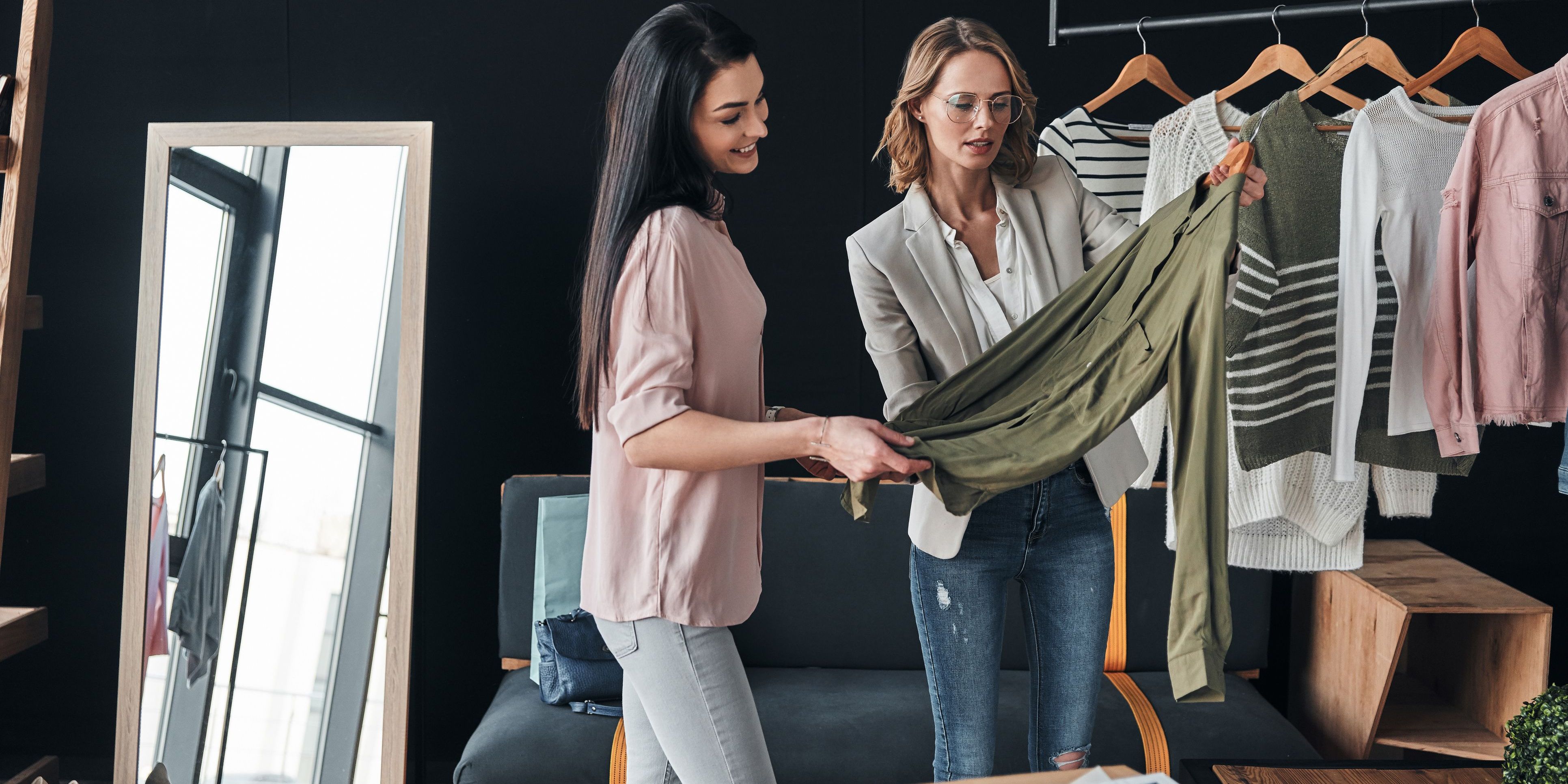 Two apparel designers looking at one of their shirt designs.