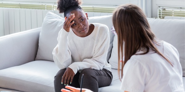 A clinical psychologist working with a patient.