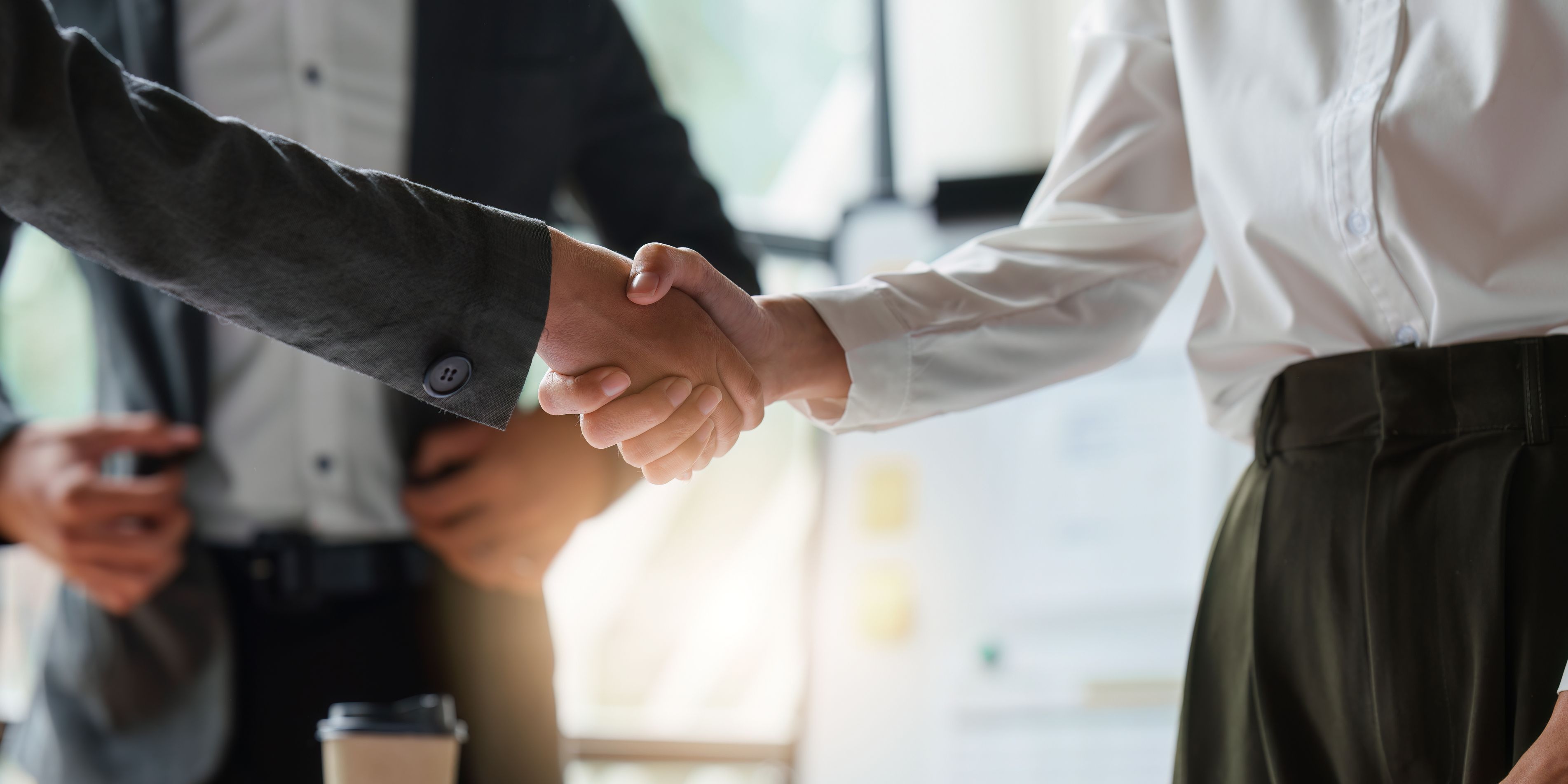 A literary agent securing a publishing deal on behalf of a client.