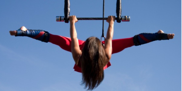 A trapeze artist practicing her routine.